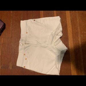 Levi’s white with rips at bottom